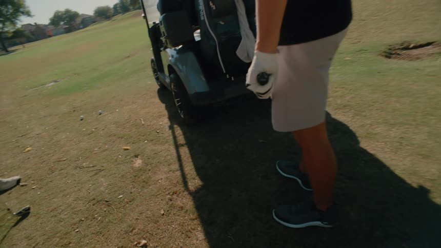 A couple men playing golf