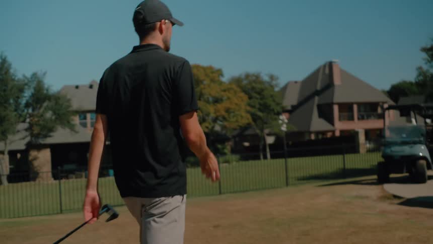 Two men getting ready to play golf
