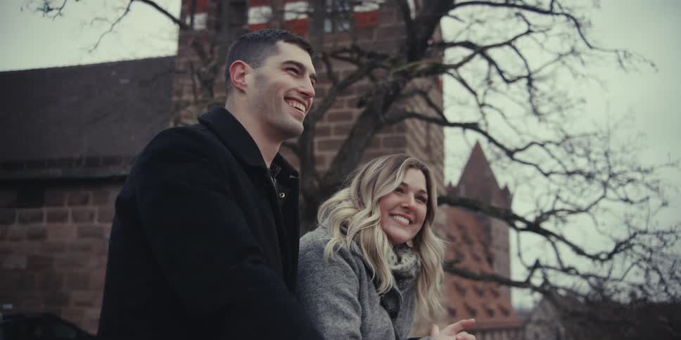 A portrait of a man and woman sitting outdoors