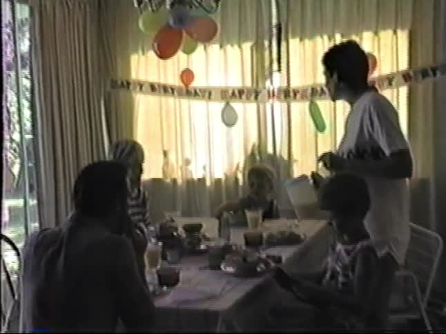 A child and friends at a birthday party