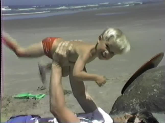 A child and mother at the beach