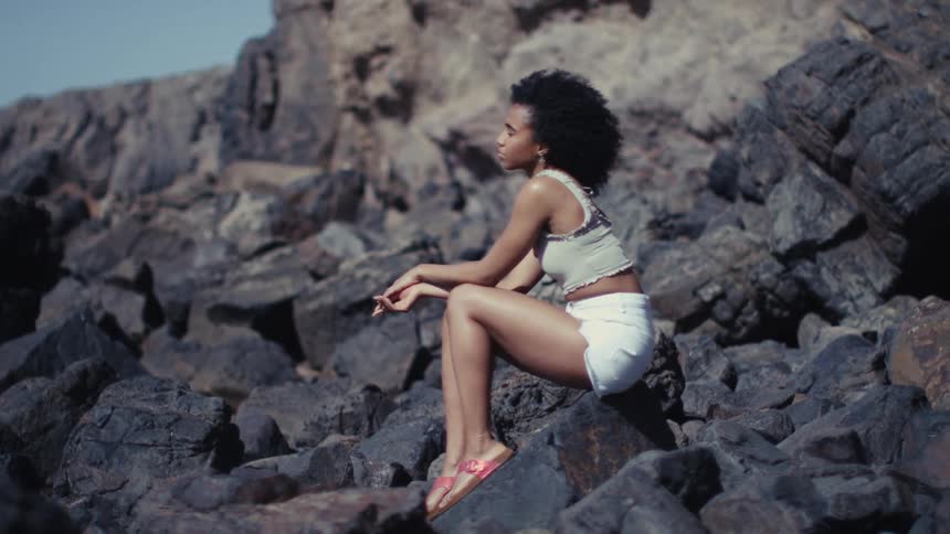 A portrait of a woman sitting outdoors