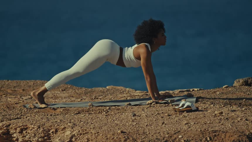 A woman doing yoga outdoors