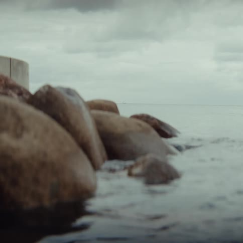 Rocks next to a body of water outdoors during day time