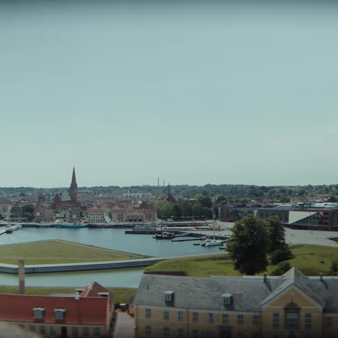 Urban view with canals historic buildings and green areas by the waterfront