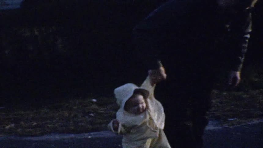 A father walking with his son outdoors
