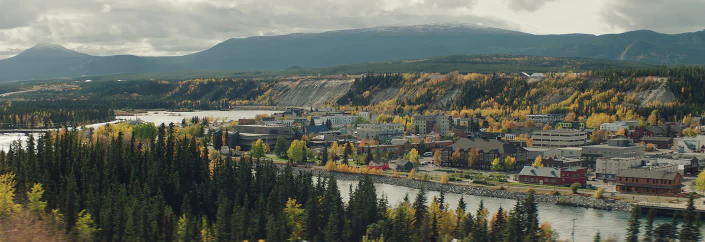 A small town by the river in autumn