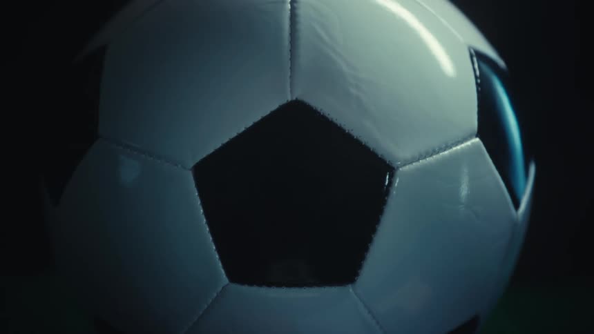 Light reflects on the soccer ball