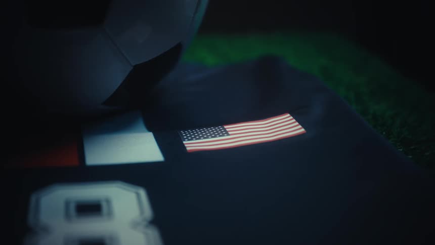 A close up of a soccer shirt and ball