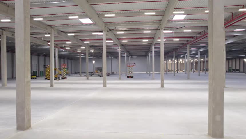 Empty industrial warehouse with concrete columns