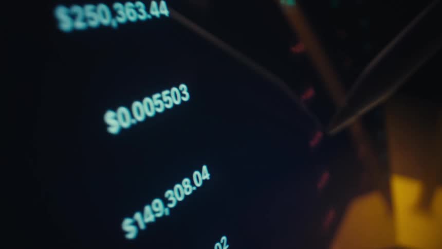 Digital pen pointing to numeric values displayed on a dark financial interface