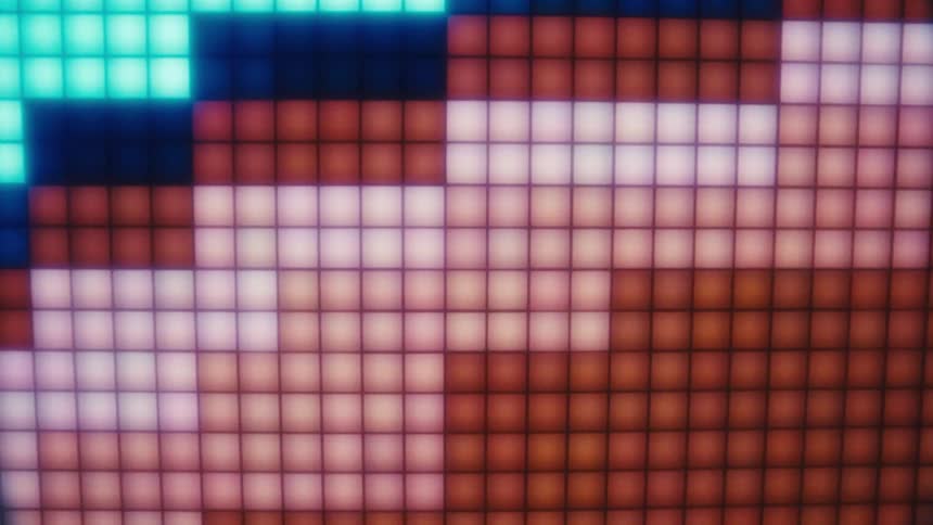 A pixelated digital display shows glowing red white and blue blocks forming shapes