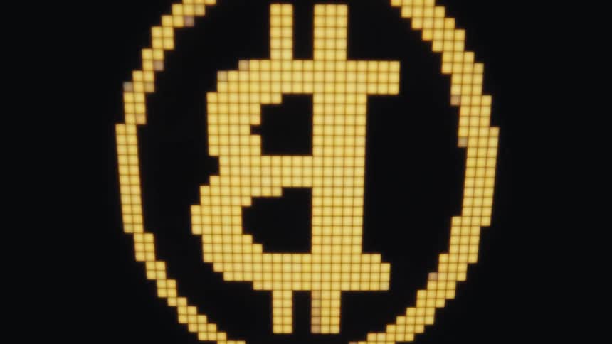 A close up of a rotating coin on a screen