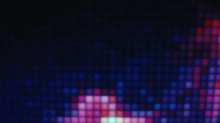 A frenetic macro view of a screen reveals shifting colorful pixels that flash and form abstract shapes in the style of a classic 8bit video game