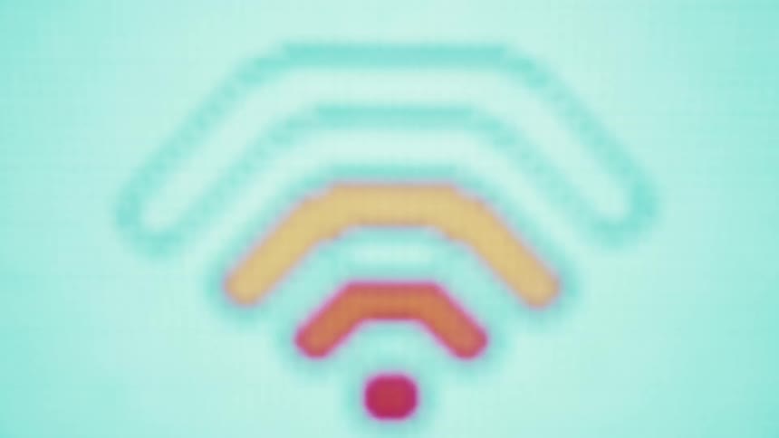 A closeup shot of a digital screen reveals a wifi icon of glowing square pixels in shades of orange yellow and blue that shift and change