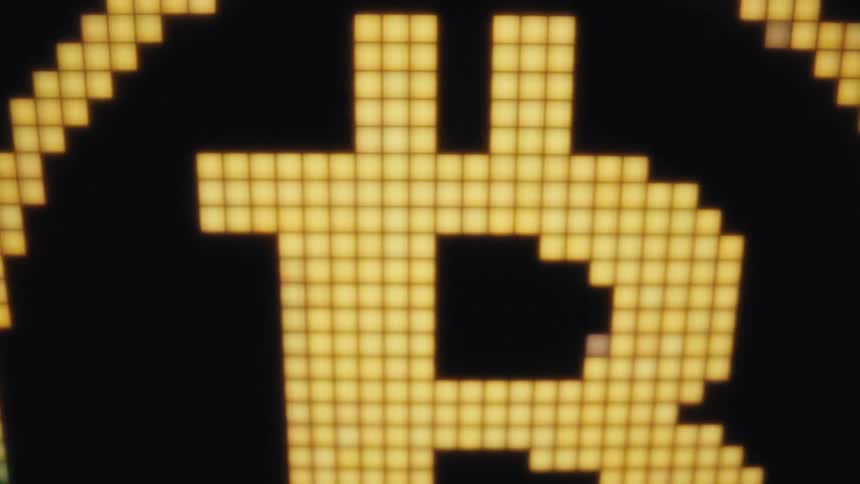 A close up of a rotating digital coin