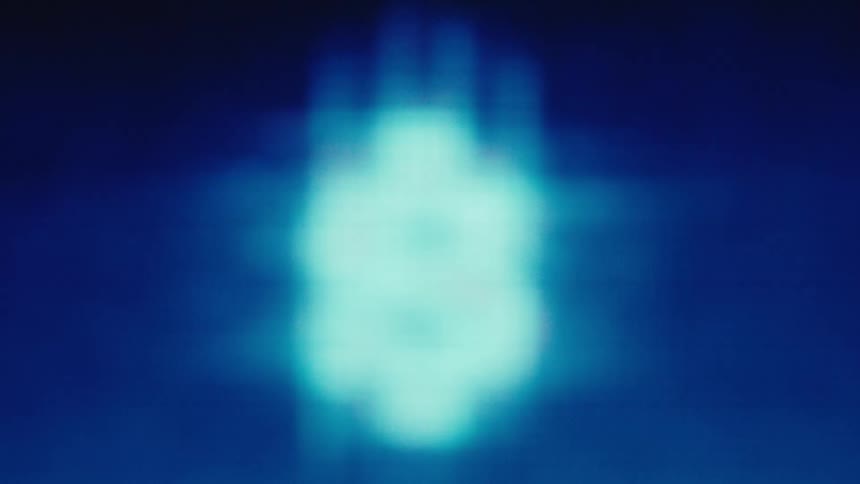 Pixelated dollar signs in vibrant tones on dark blue background