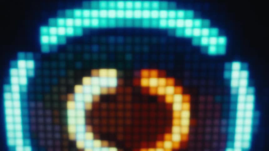 A close up shot of a digital screen reveals a grid of glowing square pixels in shades of orange yellow and blue that shift and change to a countdown