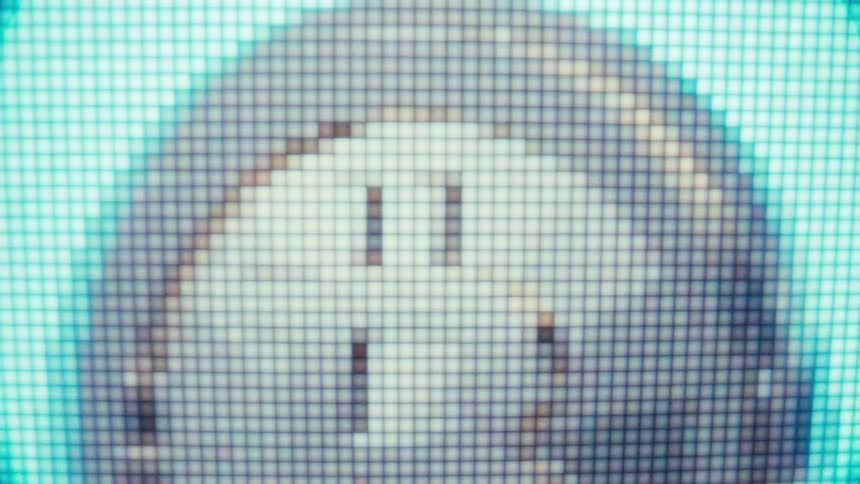 A close up of a pixel design of a coin rotating on a screen