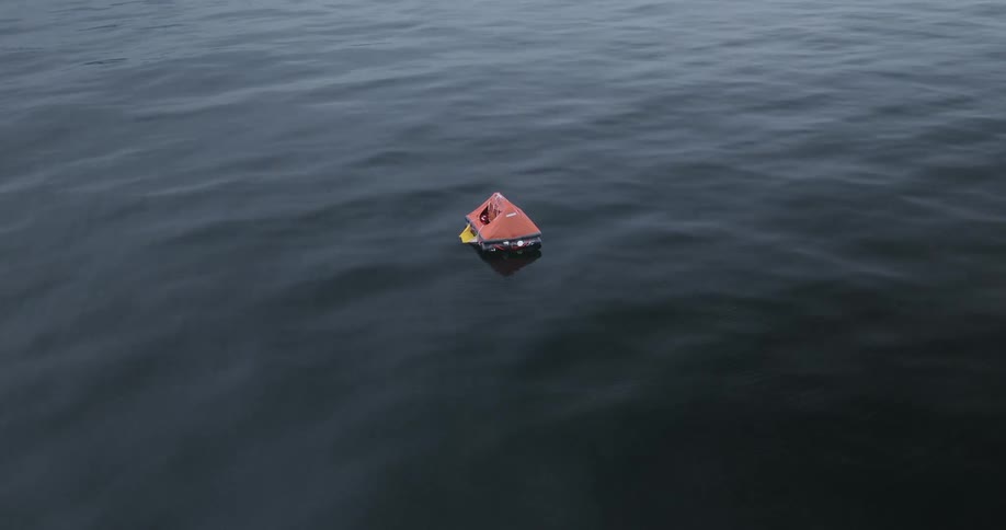A life raft is floating on the ocean