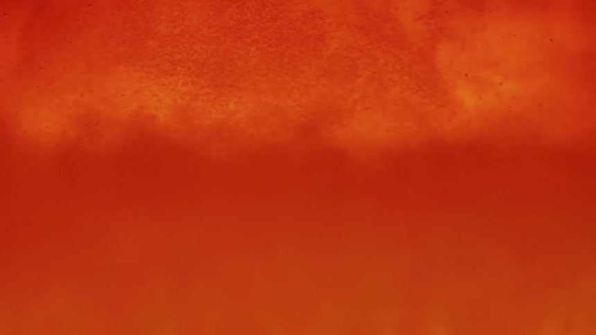 Abstract closeup of orange liquid with suspended particles