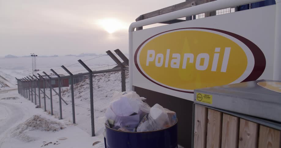 Polaroil sign at an industrial facility surrounded by snow with a polar landscape in the background