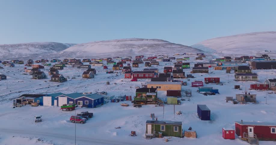An aerial view of a rural area covered in snow