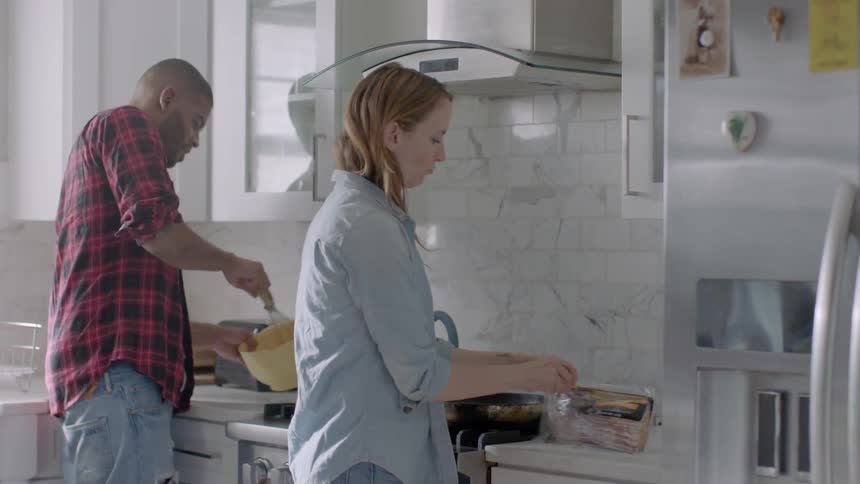 Woman and man cooking in the kitchen