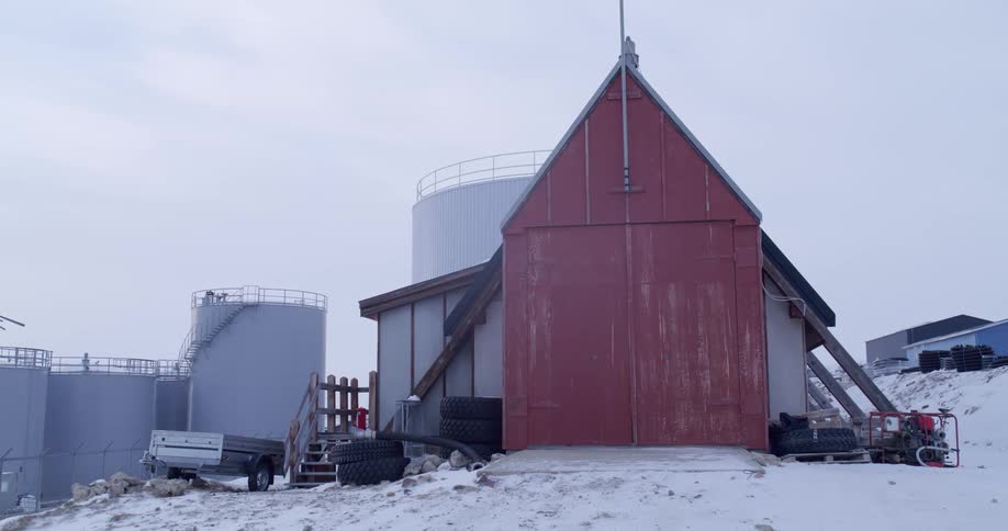 Large round storage containers on the side of a building
