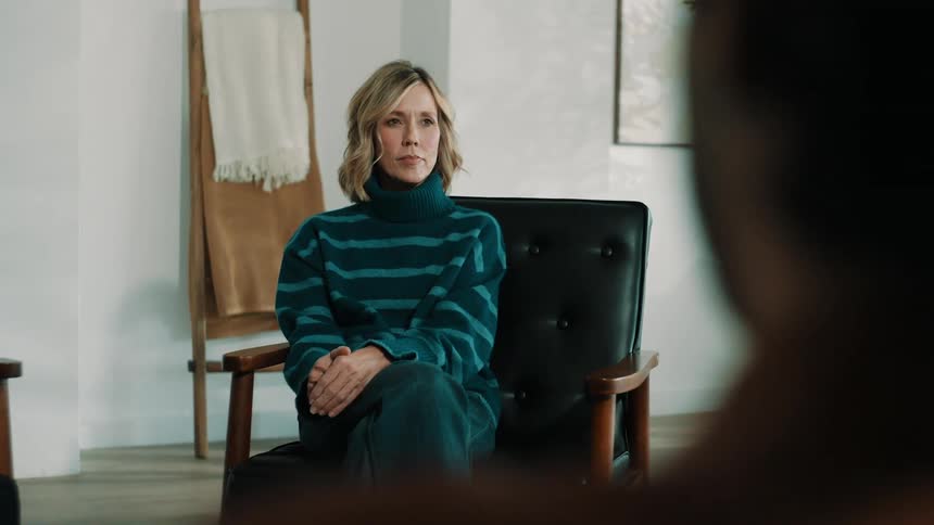 A woman sitting in a chair in a room