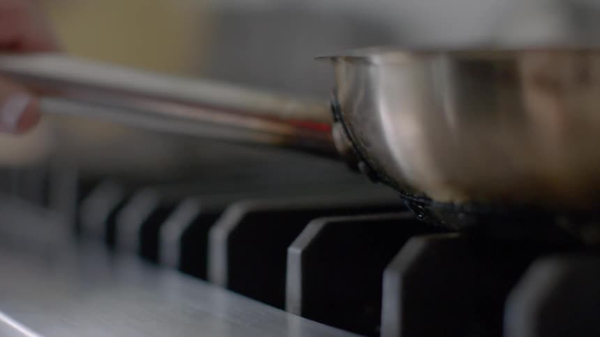 A pan is placed on a stove