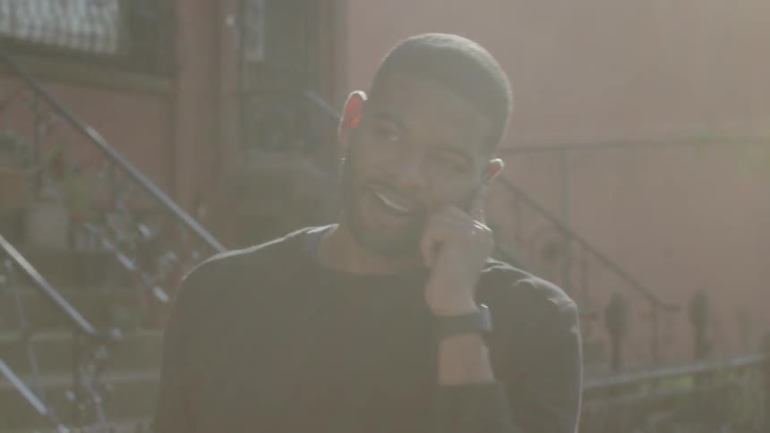 A man talks on his phone outside