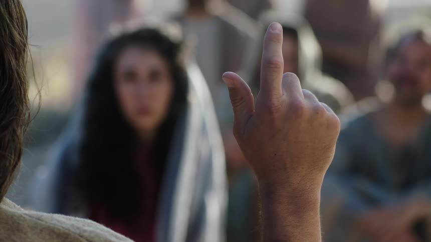 Jesus teaching followers outside