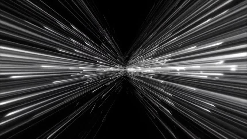 A dark void filled with fastmoving white light rays that converge at a central vanishing point