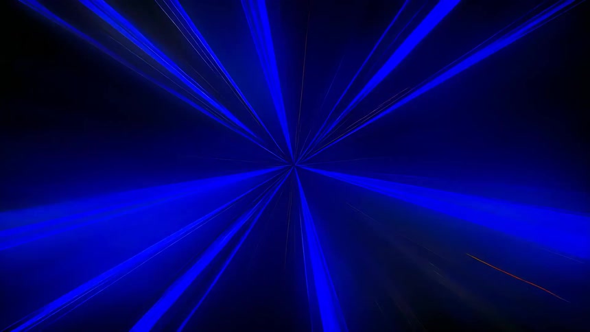 Colorful lasers extend outward from the center of pitch black darkness