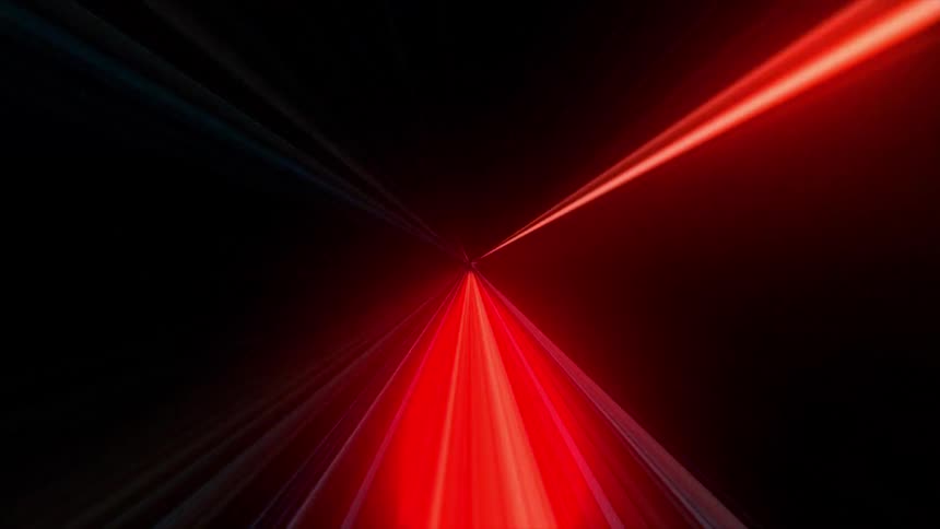 A fast moving animation features vibrant red and orange light streaks radiating from a central point against a dark background to create a tunnel effect