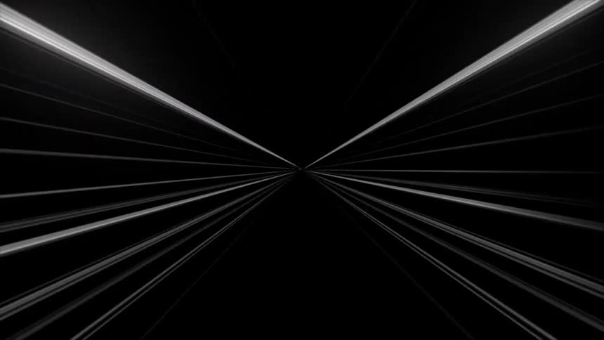 Bright white light streaks race toward a central point forming a fast abstract tunnel in darkness
