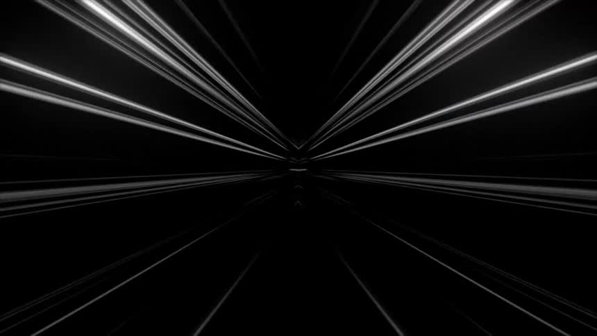White lines of light flash by in the dark