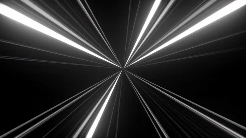 Bright light streaks form an abstract tunnel converging on a dark background