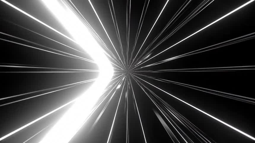 A fastmoving animation features glowing white lines radiating from a central point against a black background to create a tunnel effect