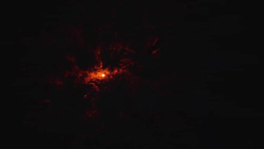 The fire moves through the dark forest