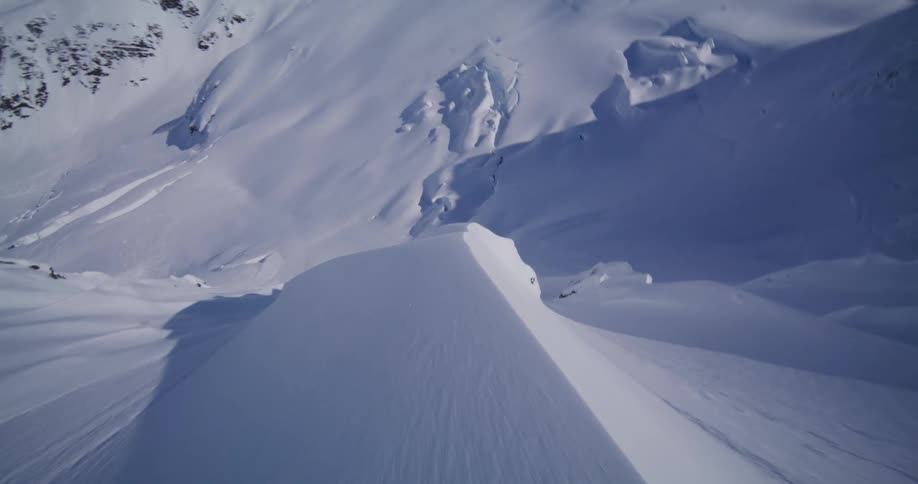 An aerial view of a mountain covered in snow