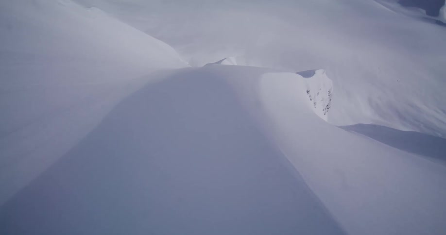 A view of a mountain range covered in snow