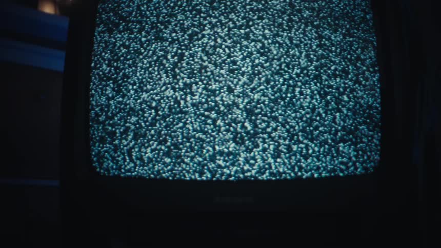 A view of an old tv with static on the screen