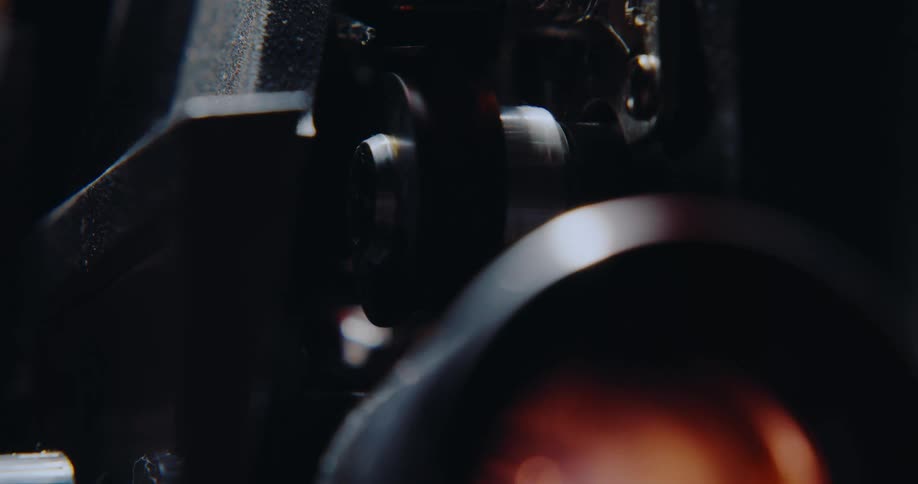 A view of a Super 8mm projector running with film going through it