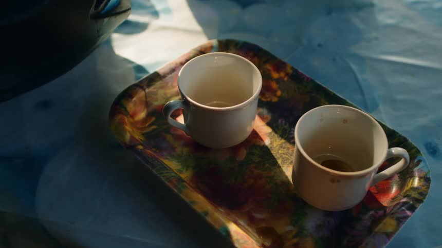Coffee cups are on the tray
