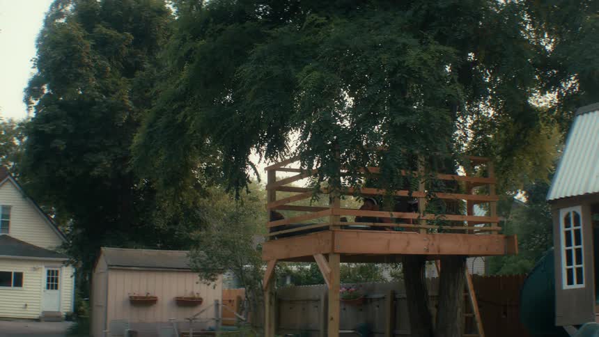 A person sitting in a tree house