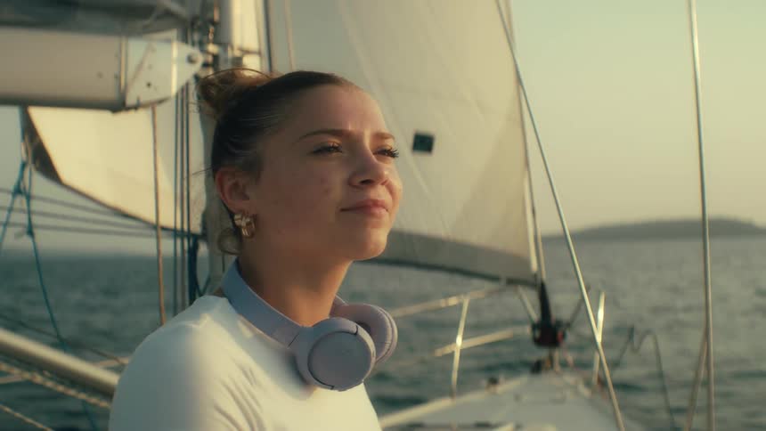 A woman using a laptop on a boat