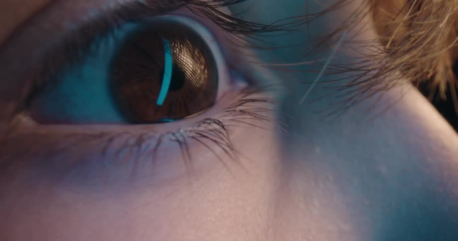 The person blinks fast as lights flash