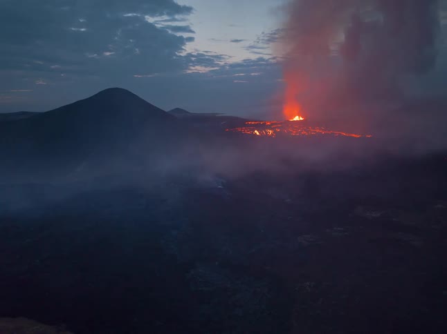 The forest in the distance is burning